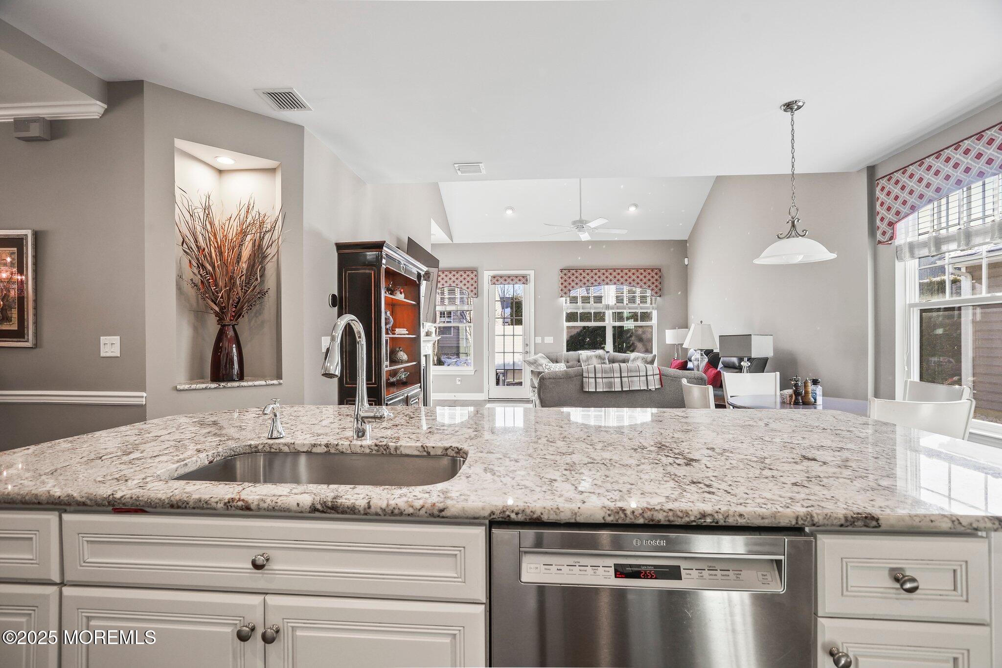 57 Harvest Ridge Road Howell, NJ 07731 - Photo 10 of 39 a kitchen with granite countertop kitchen island a counter space and windows