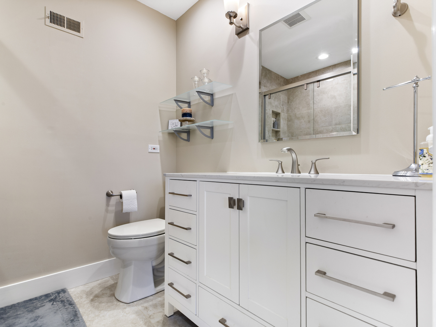 186 Shoreline Road Lake Barrington, IL 60010 - Photo 14 of 25 a bathroom with a sink a toilet and mirror