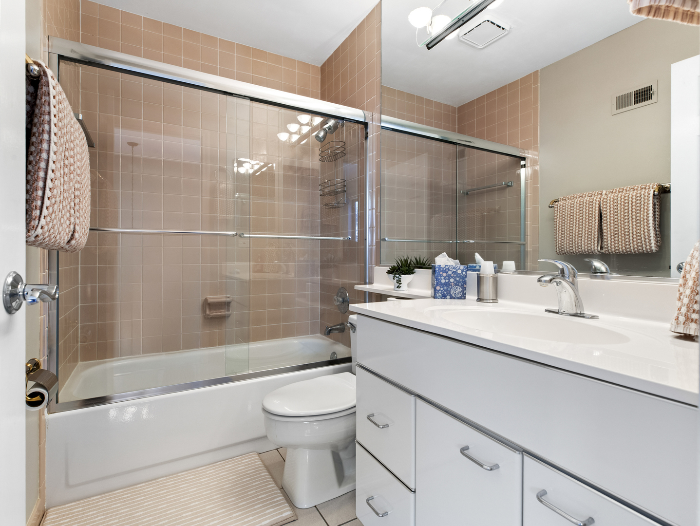 186 Shoreline Road Lake Barrington, IL 60010 - Photo 17 of 25 a bathroom with a sink a toilet and shower