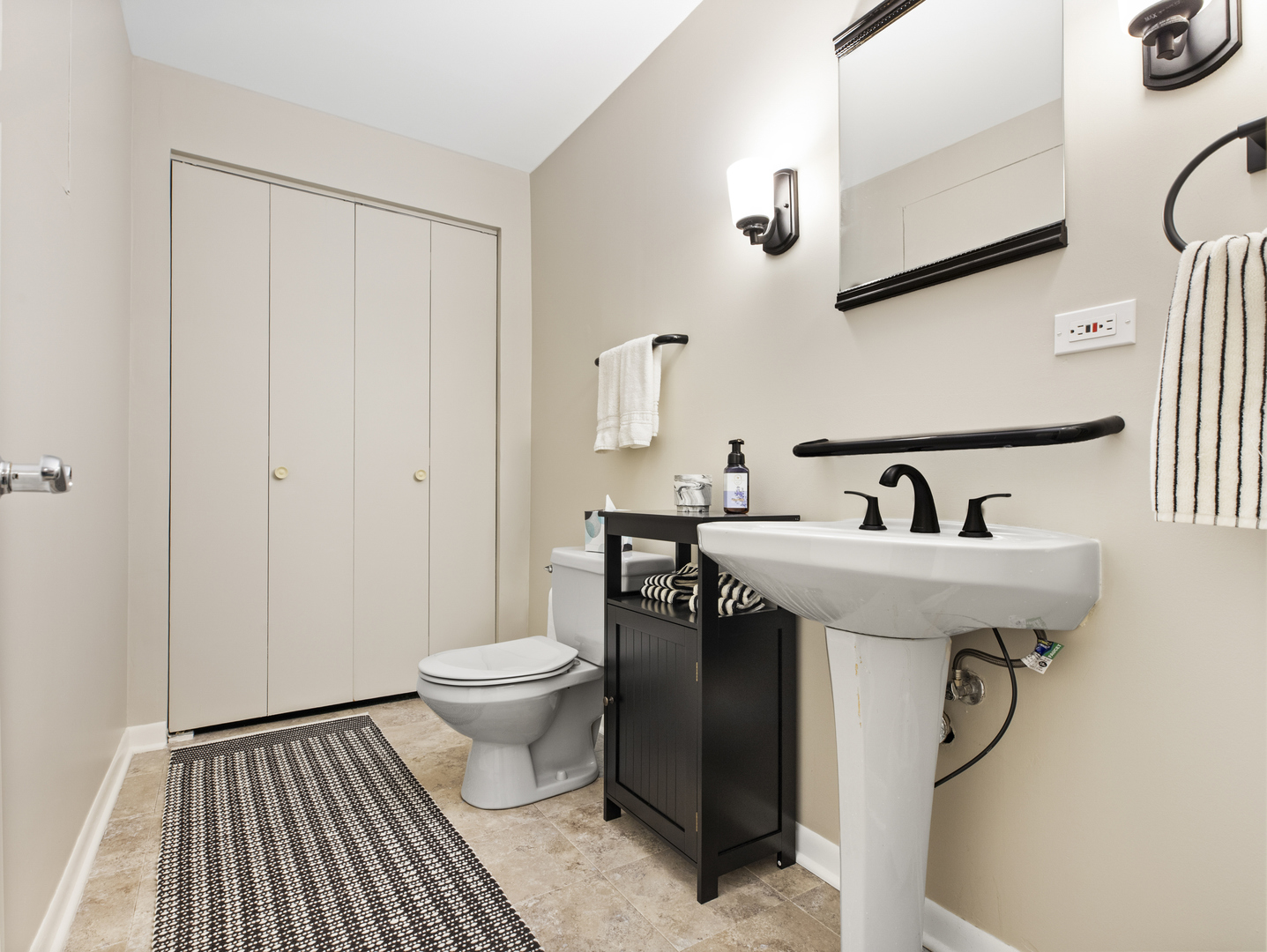 186 Shoreline Road Lake Barrington, IL 60010 - Photo 18 of 25 a bathroom with a sink a toilet and a mirror