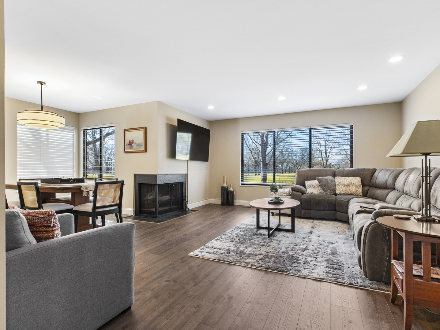 186 Shoreline Road Lake Barrington, IL 60010 - Photo 2 of 25 a living room with fireplace furniture and a large window