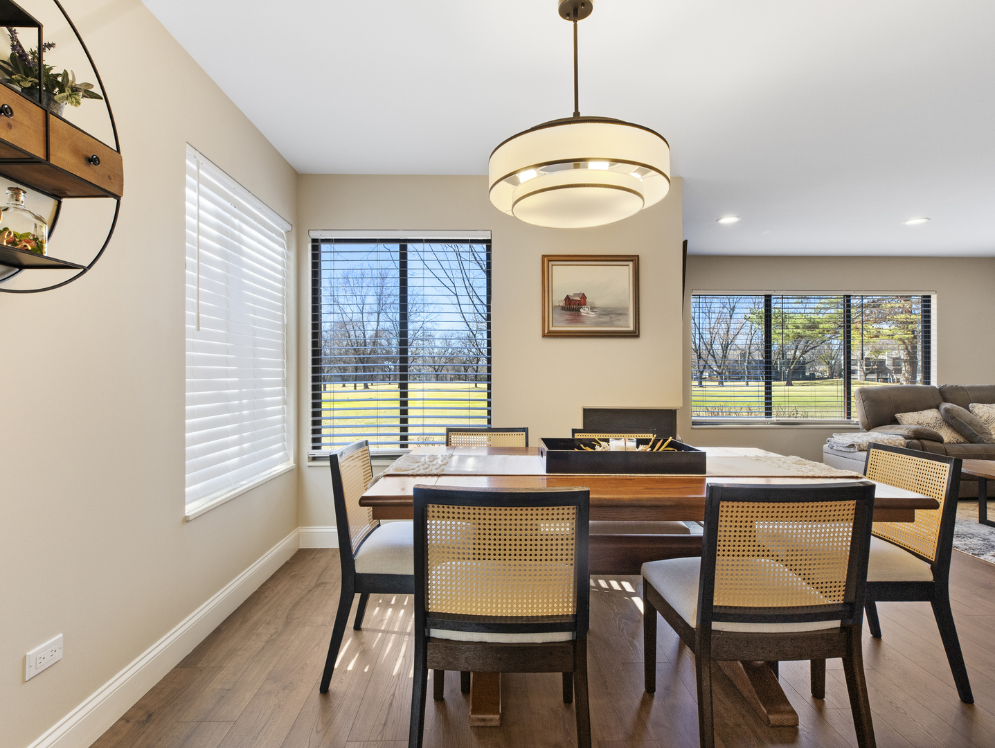 186 Shoreline Road Lake Barrington, IL 60010 - Photo 6 of 25 a dining room with wooden floor a chandelier a wooden table and chairs