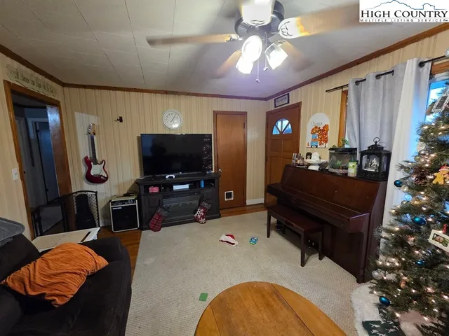 a living room with furniture and a flat screen tv
