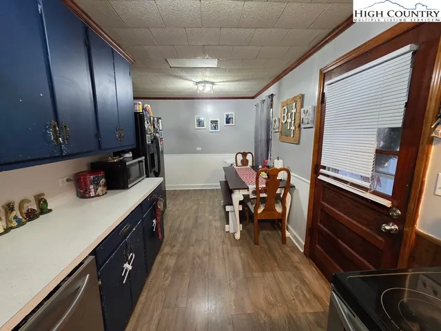 a view of a chairs and table in a kitchen