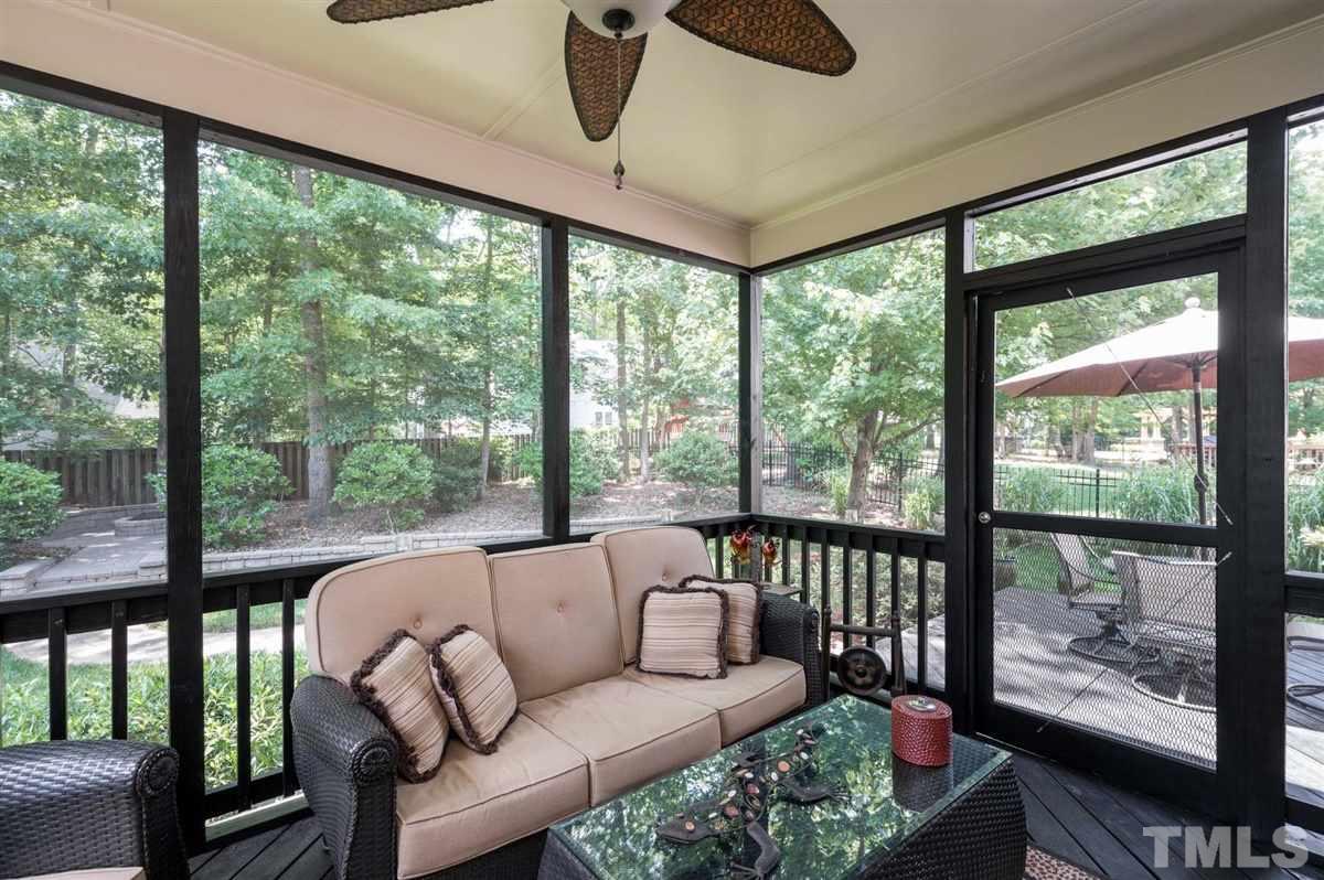 1004 Bianco Drive Raleigh, NC 27607 - Photo 12 of 30 a living room with furniture and a floor to ceiling window