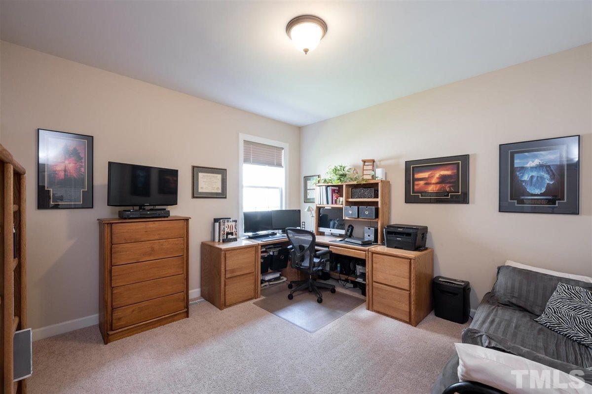 1004 Bianco Drive Raleigh, NC 27607 - Photo 13 of 30 a view of a livingroom with workspace and a couch