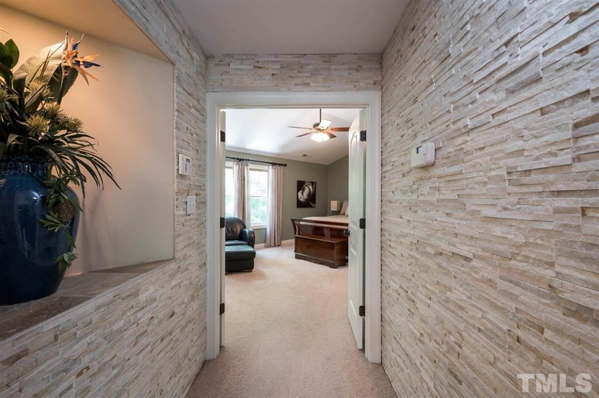 1004 Bianco Drive Raleigh, NC 27607 - Photo 15 of 30 a view of a hallway to a livingroom with furniture