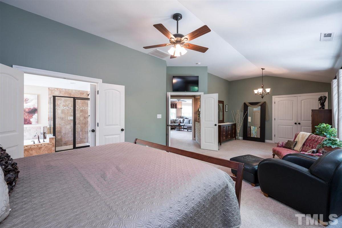 1004 Bianco Drive Raleigh, NC 27607 - Photo 17 of 30 a living room with furniture and a ceiling fan