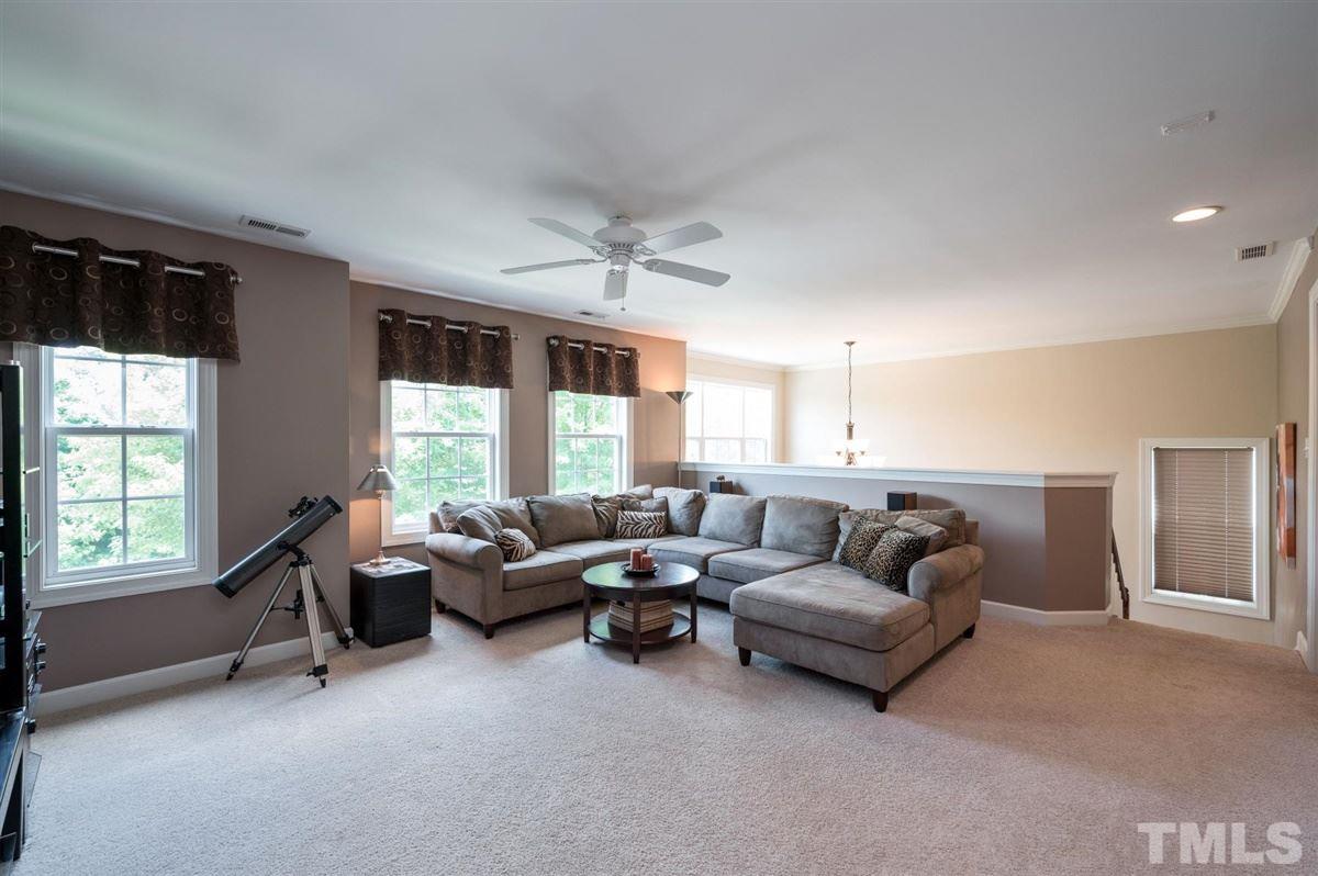 1004 Bianco Drive Raleigh, NC 27607 - Photo 21 of 30 a living room with furniture and a large window
