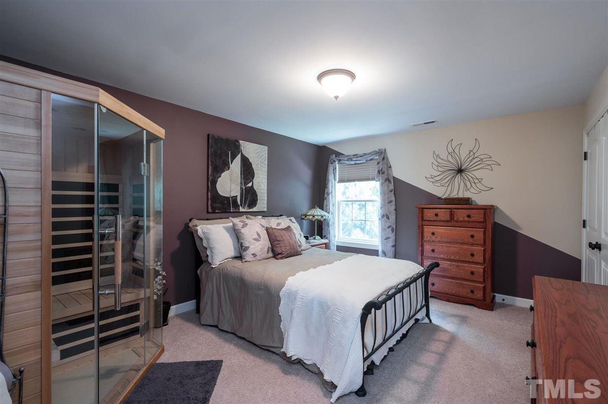 1004 Bianco Drive Raleigh, NC 27607 - Photo 23 of 30 a bedroom with a bed and a dresser