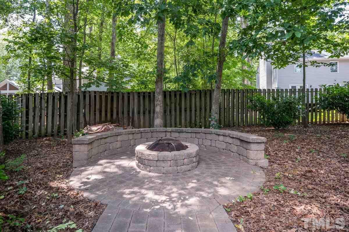 1004 Bianco Drive Raleigh, NC 27607 - Photo 27 of 30 a backyard of a house with table and chairs