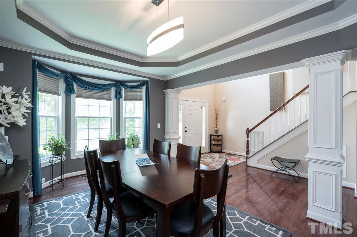 1004 Bianco Drive Raleigh, NC 27607 - Photo 5 of 30 a view of a dining room with furniture window and wooden floor