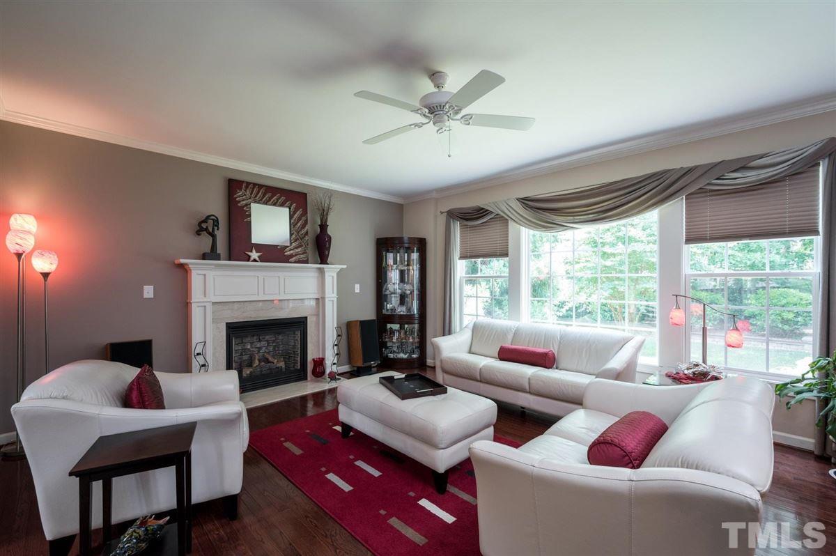 1004 Bianco Drive Raleigh, NC 27607 - Photo 6 of 30 a living room with furniture and a fireplace