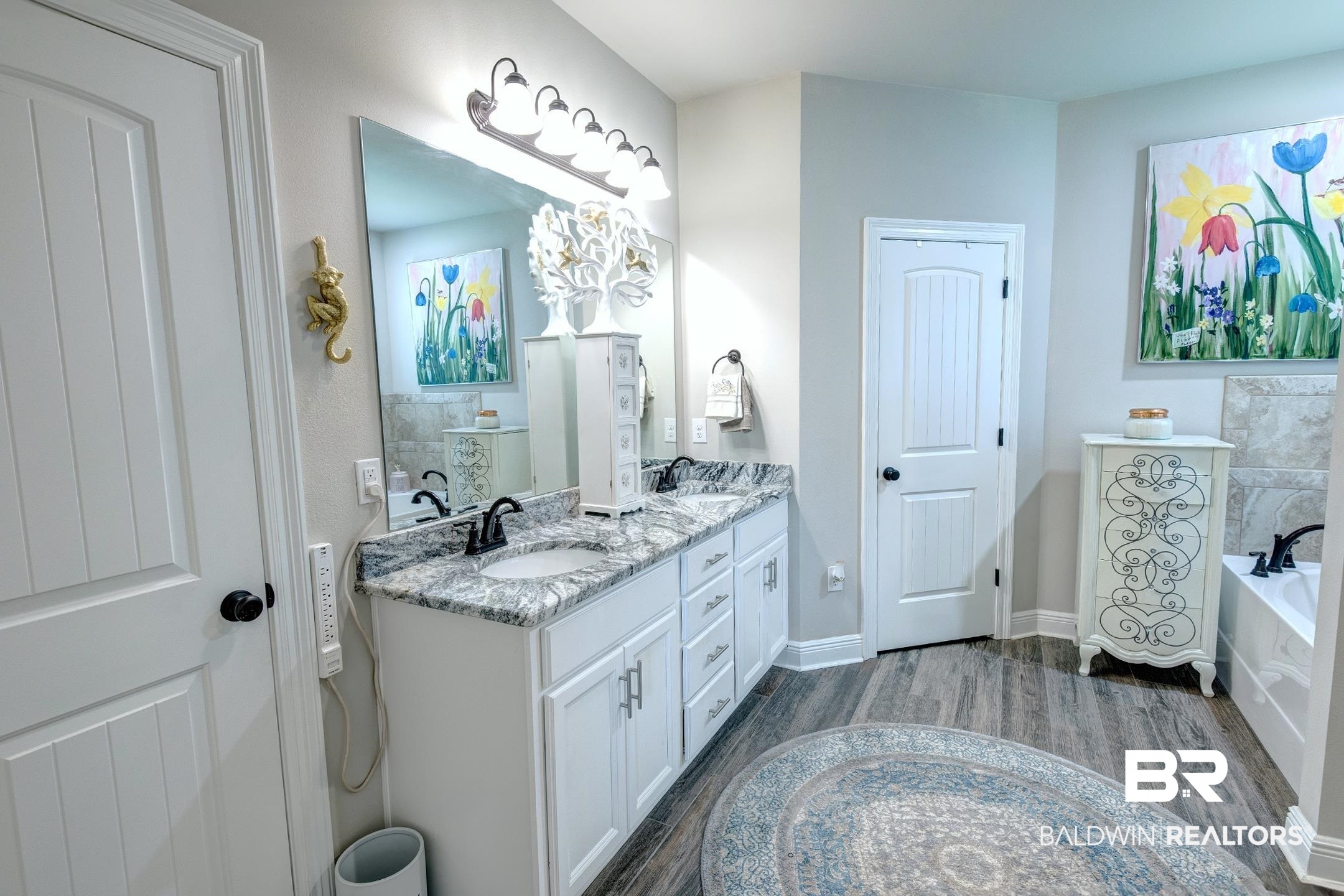 9988 Dunleith Loop Daphne, AL 36526 - Photo 42 of 51 Bathroom featuring dual bowl vanity, hardwood / wood-style floors, and a bath