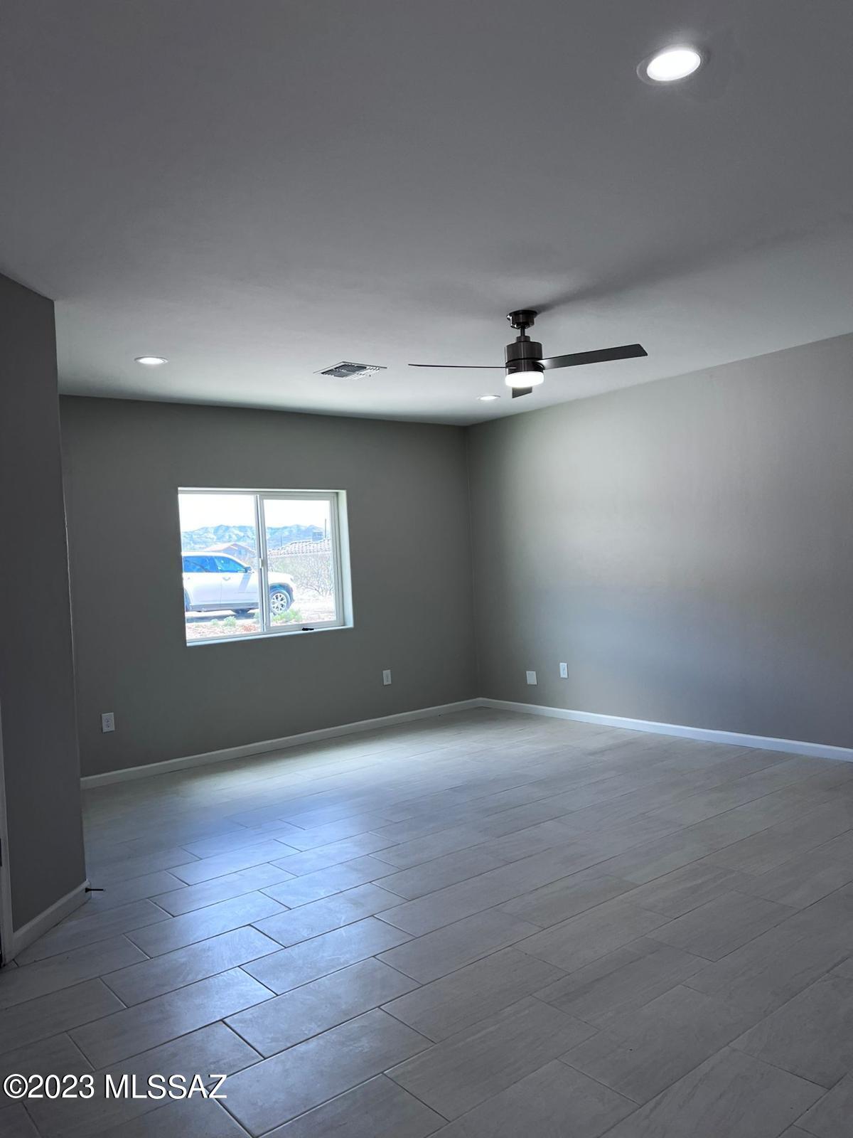 1792 Portugal Court Rio Rico, AZ 85648 - Photo 7 of 14 a view of an empty room with a window