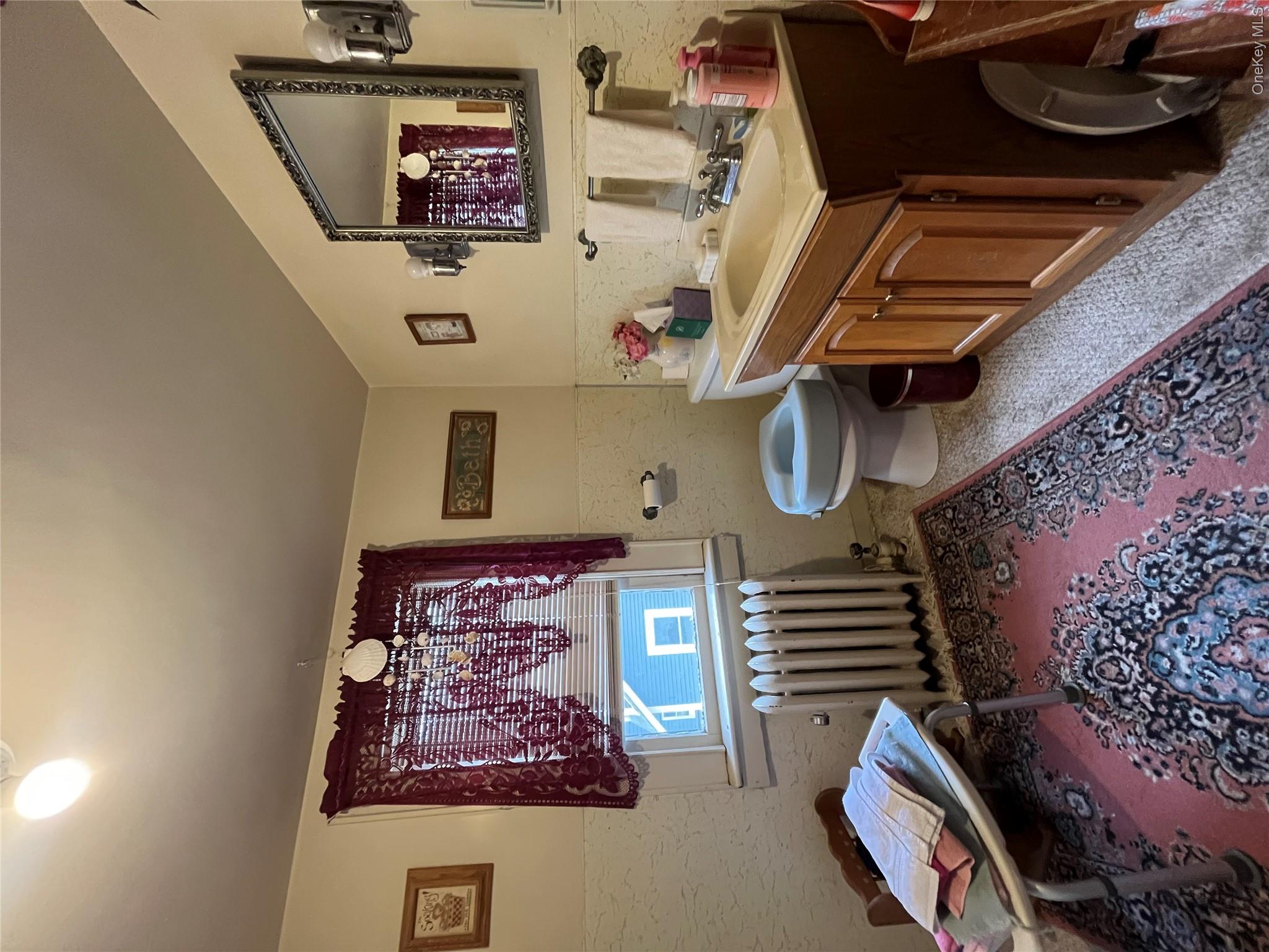 35 Spring Street Goshen, NY 10924 - Photo 21 of 26 a living room with furniture and a baby crib