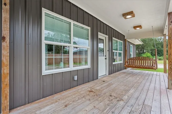 a view of outdoor space with wooden floor and iron stairs