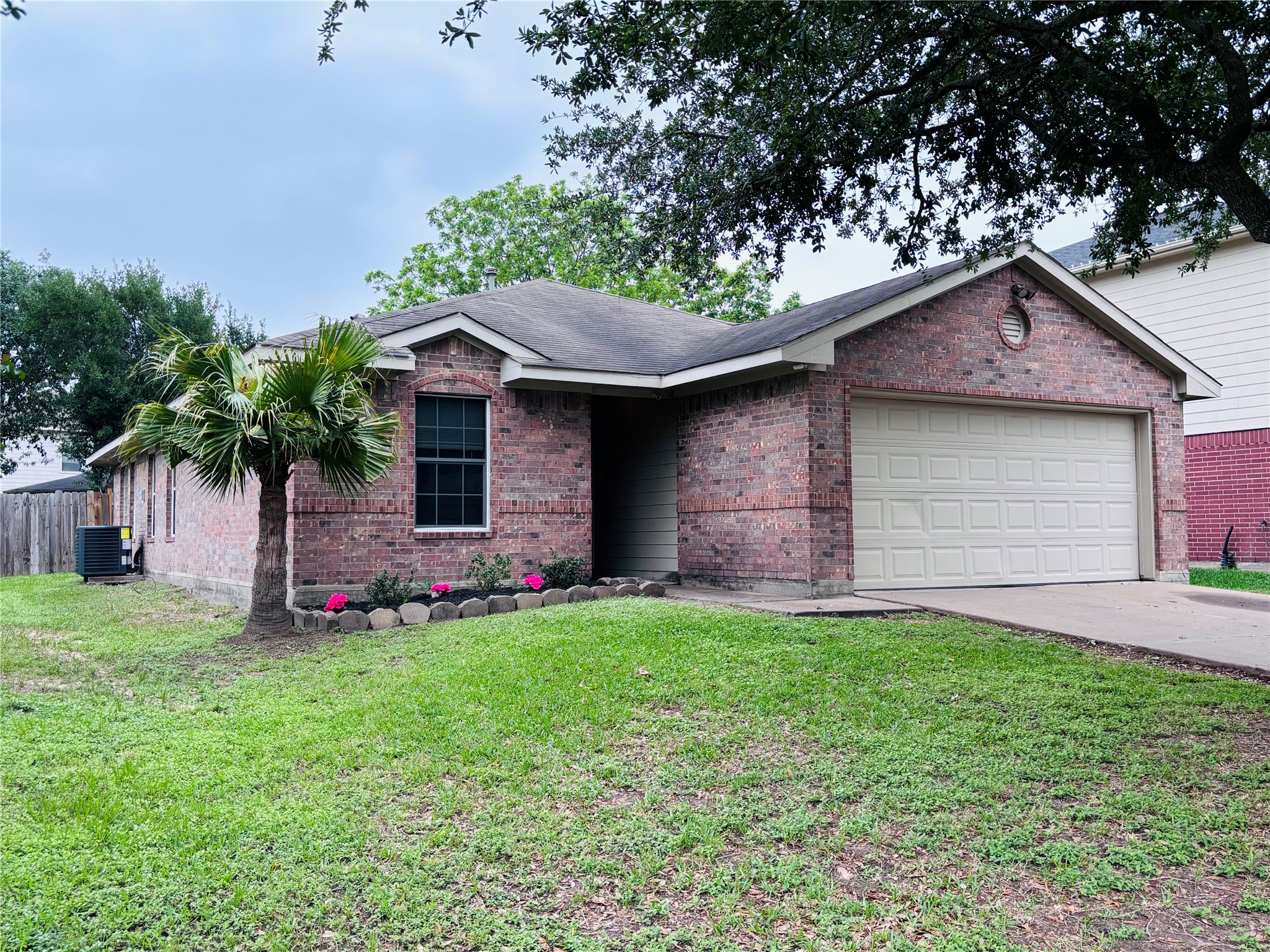 6402 Hayman Drive Katy, TX 77449 - Photo 2 of 9 a front view of house with yard and garage