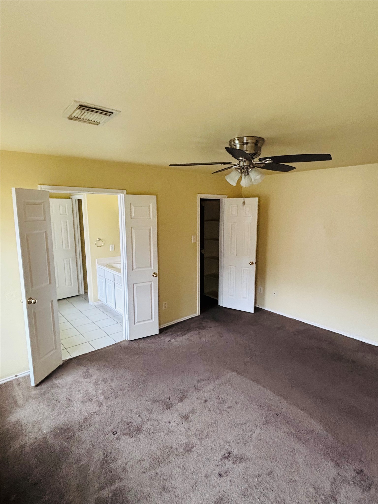 6402 Hayman Drive Katy, TX 77449 - Photo 4 of 9 an empty room with a fireplace and painted walls