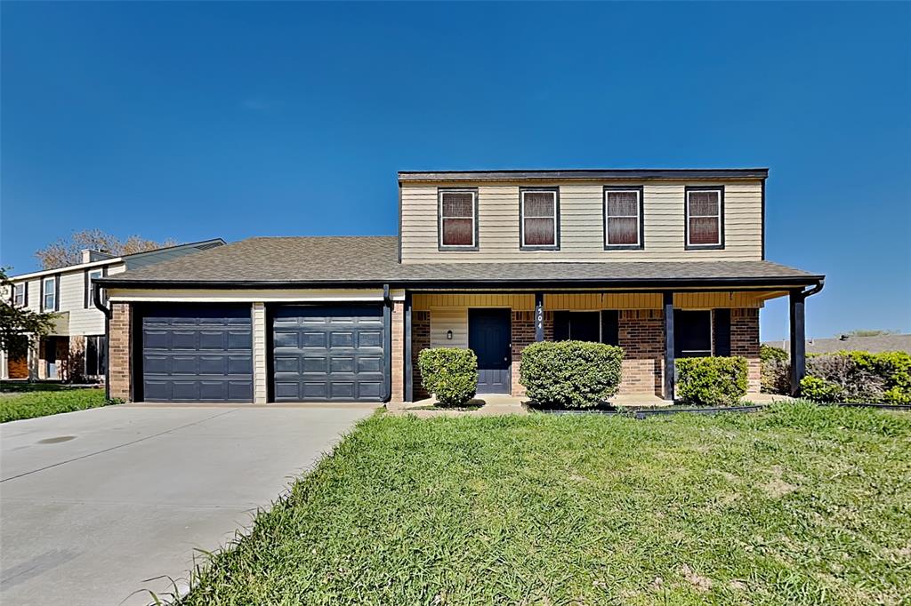 1504 Homestead Street Flower Mound, TX 75028 - Photo 1 of 22 a front view of a house with garden