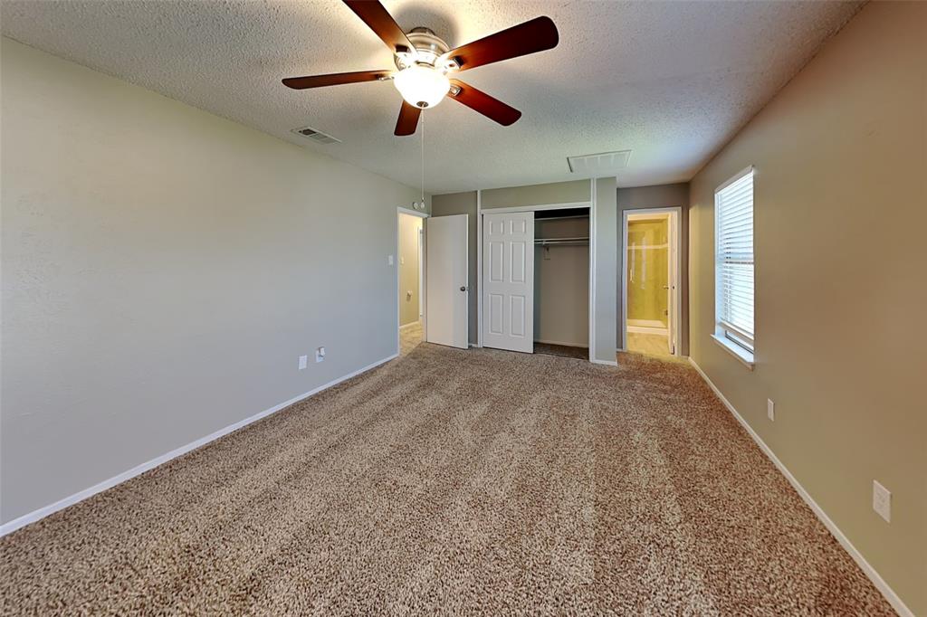 1504 Homestead Street Flower Mound, TX 75028 - Photo 11 of 22 an empty room with chandelier fan and windows