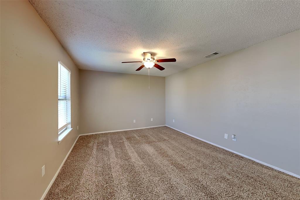 1504 Homestead Street Flower Mound, TX 75028 - Photo 12 of 22 a view of a livingroom with a ceiling fan and window