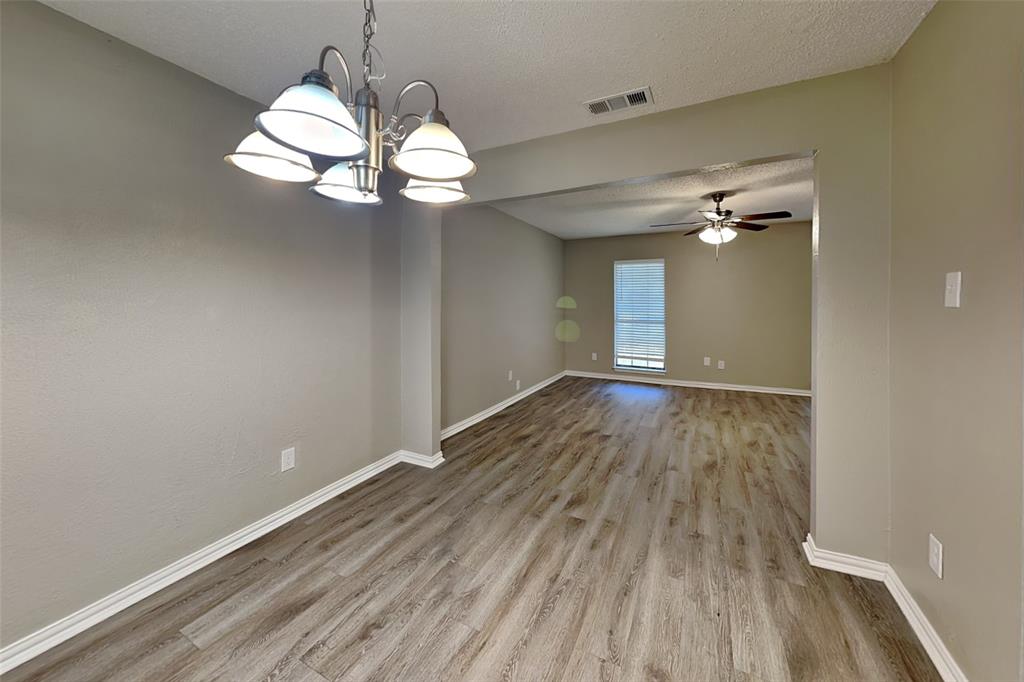 1504 Homestead Street Flower Mound, TX 75028 - Photo 10 of 22 wooden floor in an empty room with a window