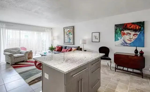 a living room with furniture and a rug