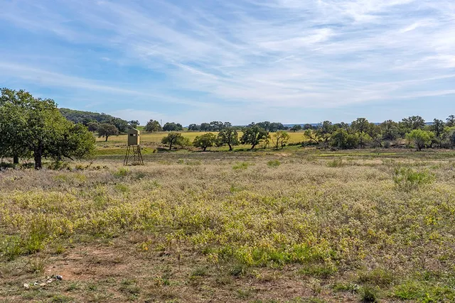 a view of a lake with houses in the back