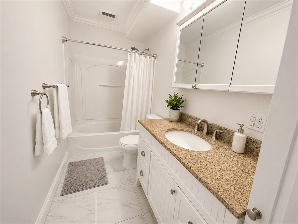 6 Forest Street, Unit 2 Boston, MA 02119 - Photo 3 of 8 a bathroom with a granite countertop sink toilet and shower