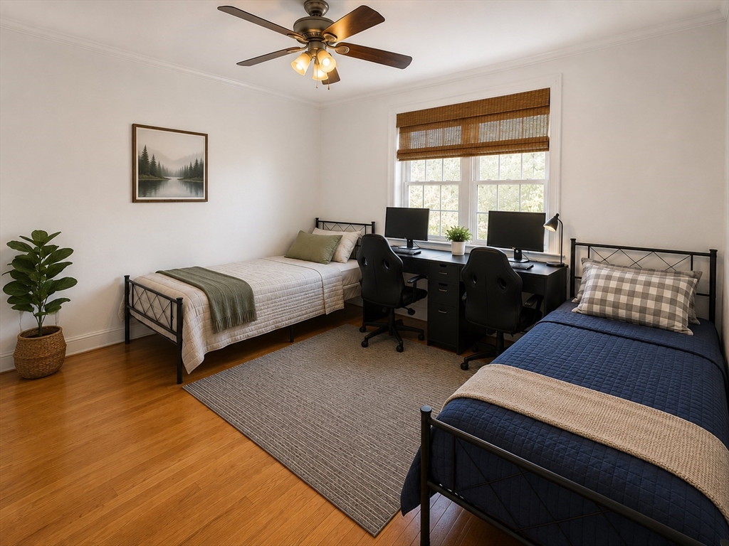6 Forest Street, Unit 2 Boston, MA 02119 - Photo 5 of 8 a bedroom with furniture and a window