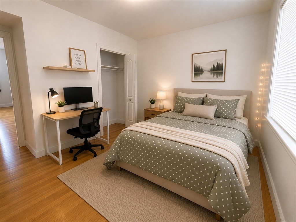 6 Forest Street, Unit 2 Boston, MA 02119 - Photo 6 of 8 a bedroom with a bed and a desk