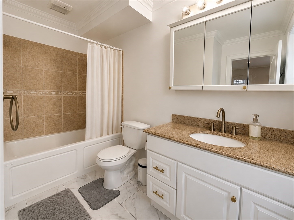 6 Forest Street, Unit 2 Boston, MA 02119 - Photo 8 of 8 a bathroom with a granite countertop sink toilet and shower