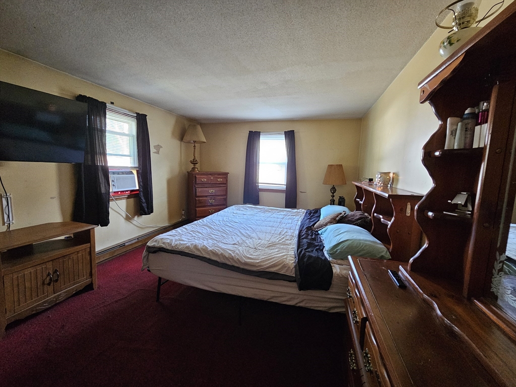 45 Dimmick Street Springfield, MA 01109 - Photo 14 of 22 a bed room with a bed and a television
