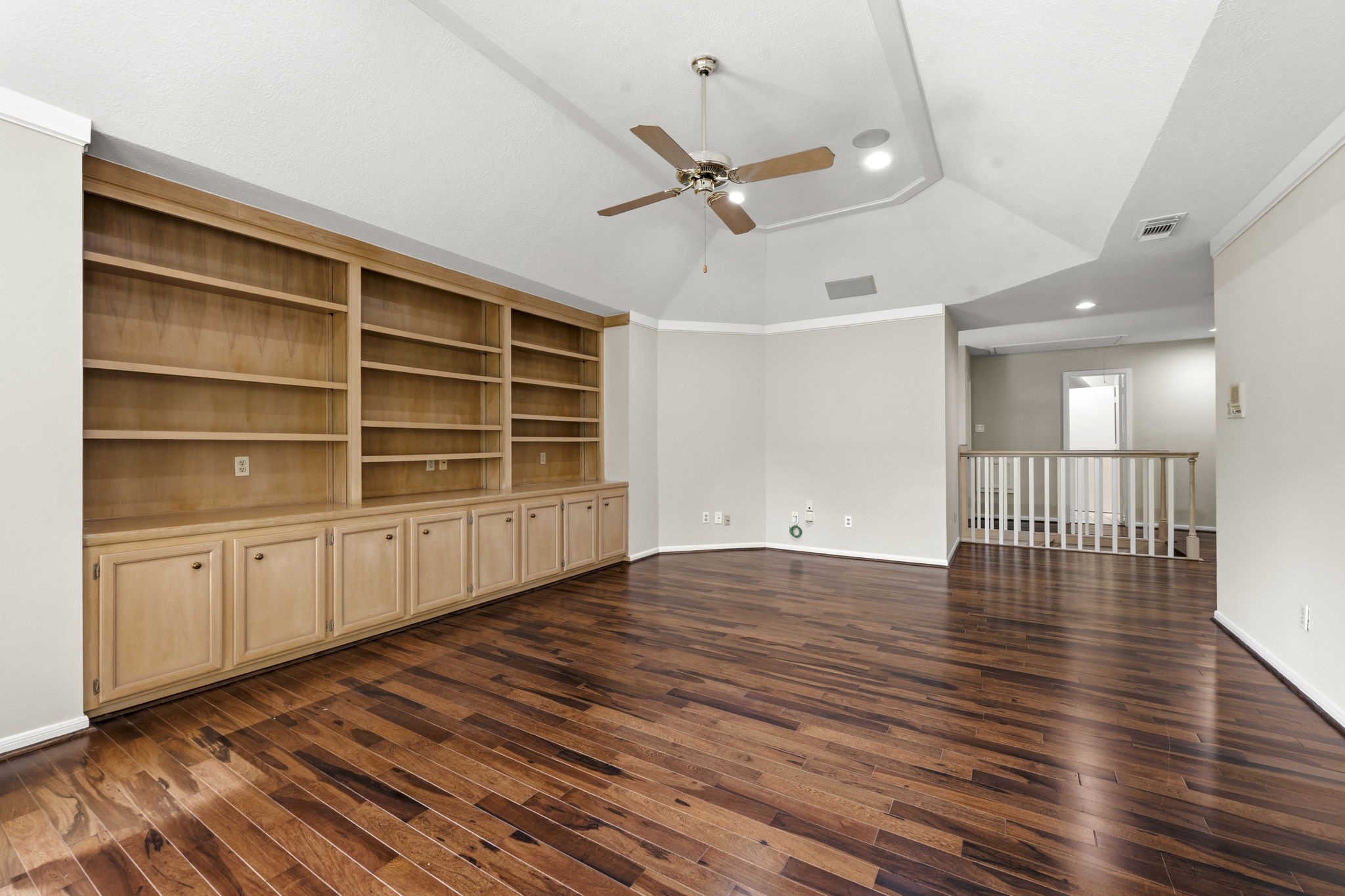 18503 Cabaniss Circle Spring, TX 77379 - Photo 38 of 49 At approx 21' x 14', the Game Room layout offers exceptional flexibility while the wall of custom built-ins provides abundant storage and display space.