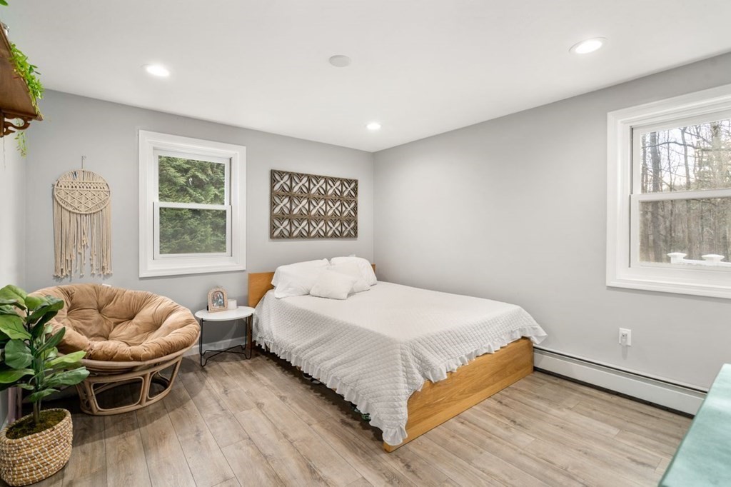 22 Dennison Cross Road Southbridge, MA 01550 - Photo 16 of 38 a bedroom with a bed and wooden floor