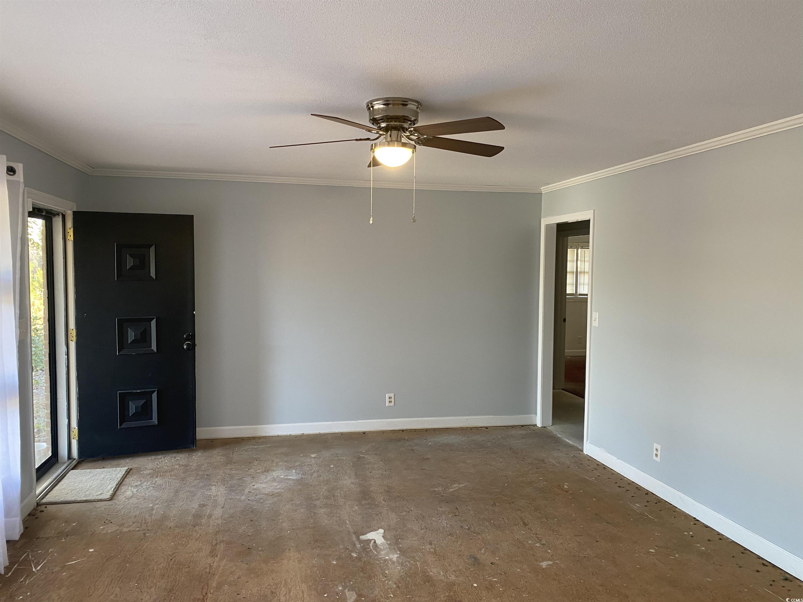 1763 St James Road Hemingway, SC 29554 - Photo 4 of 29 Spare room with ornamental molding, ceiling fan, a
