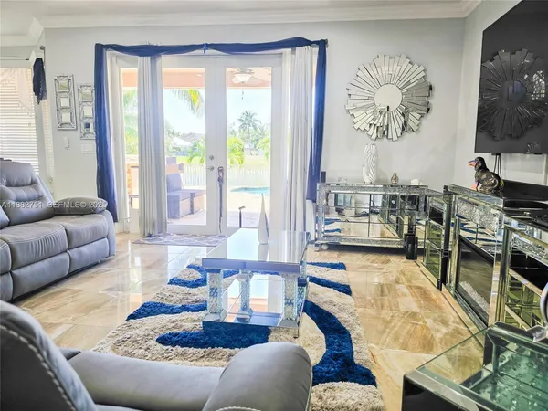 a living room with furniture and a flat screen tv