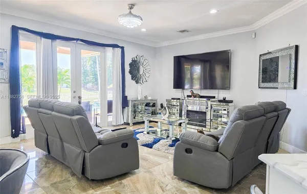 a view of a livingroom and dining room and furniture
