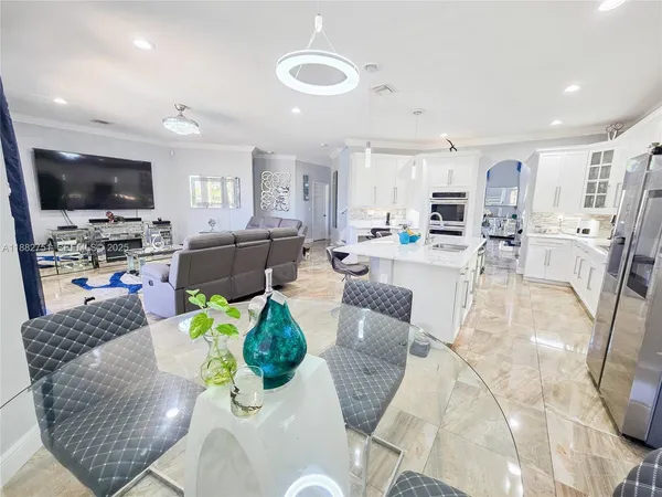 a kitchen with a sink cabinets and window