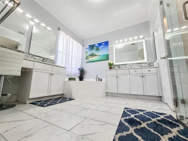 a bathroom with a bathtub sink and toilet