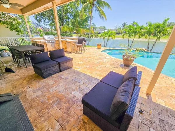 a outdoor space with patio the couches and pool