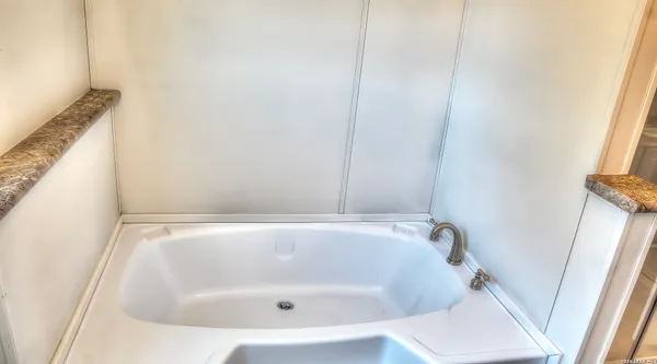 a white bath tub sitting in a bathroom