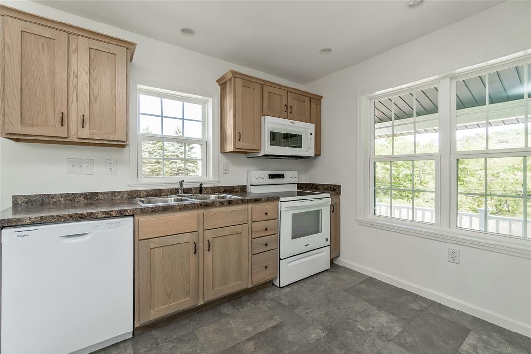 624 Main Road Lehighton, PA 18235 - Photo 19 of 42 A well-equipped kitchen awaits, featuring a built-in microwave and modern appliances.