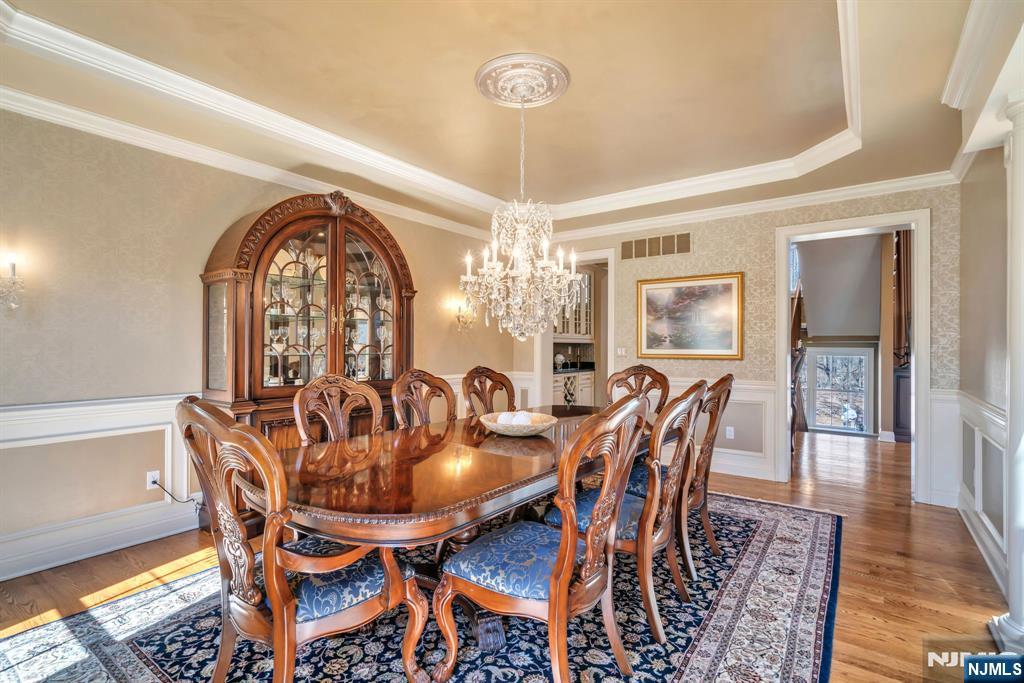 28 Arbor Road North Caldwell, NJ 07006 - Photo 12 of 50 a dining room with furniture a chandelier and wooden floor