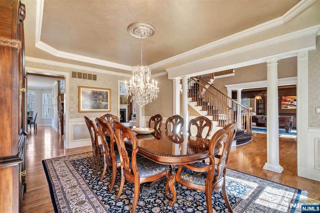 28 Arbor Road North Caldwell, NJ 07006 - Photo 13 of 50 a view of a dining room with furniture wooden floor and chandelier