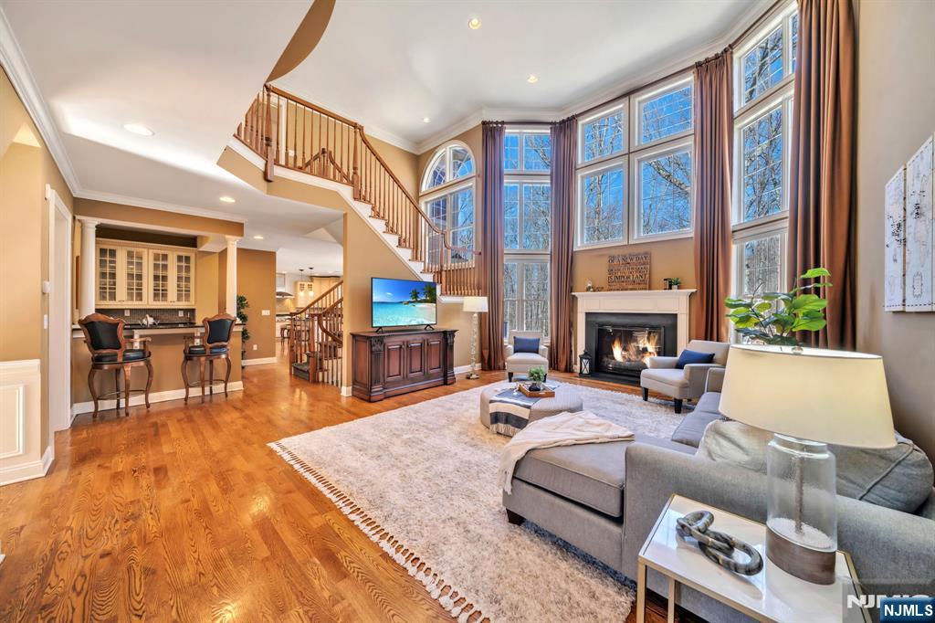 28 Arbor Road North Caldwell, NJ 07006 - Photo 14 of 50 a living room with fireplace furniture and a large window
