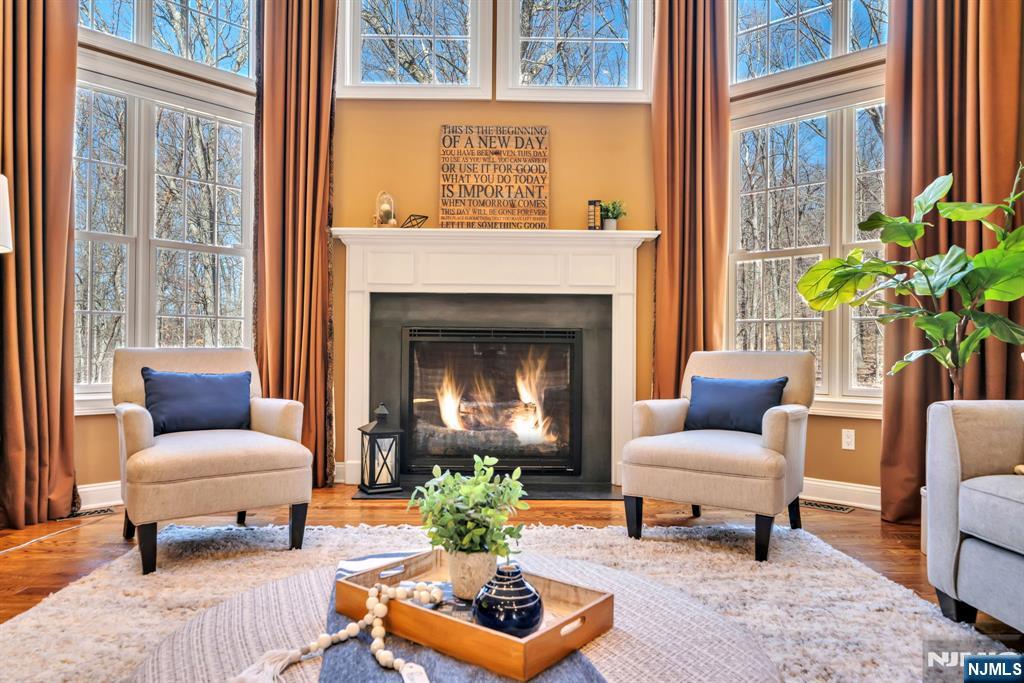 28 Arbor Road North Caldwell, NJ 07006 - Photo 18 of 50 a living room with furniture and a fireplace