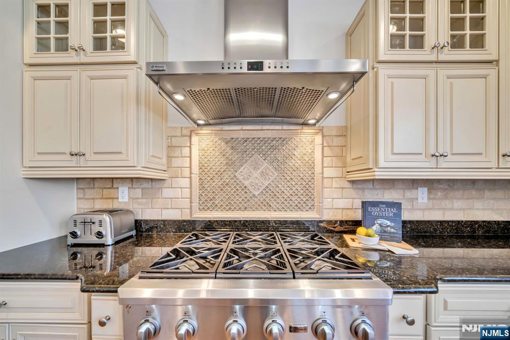 28 Arbor Road North Caldwell, NJ 07006 - Photo 25 of 50 a kitchen with stainless steel appliances granite countertop a stove and a sink