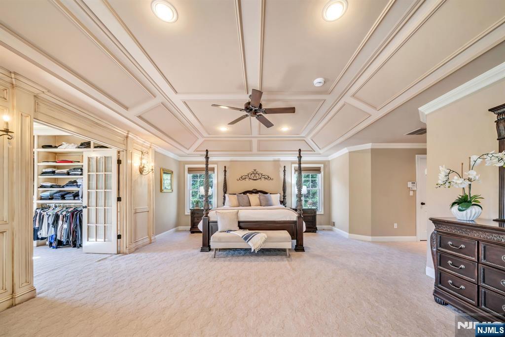 28 Arbor Road North Caldwell, NJ 07006 - Photo 30 of 50 a bedroom with furniture and a chandelier